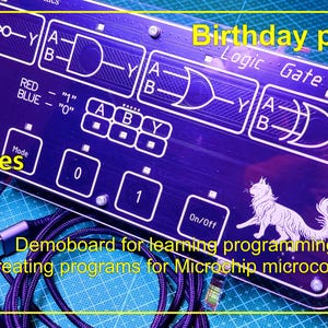 May include: A rectangular dark blue logic gate learning board featuring white printed circuit diagrams, logic symbols, and the text 'Logic Gate', 'Birthday present', and 'Demoboard for learning programming and creating programs for Microchip microcontrollers'.