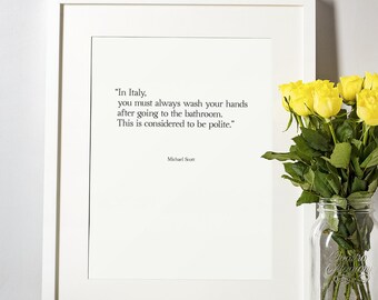 May include: A white framed print with a quote by Michael Scott from the TV show "The Office" that reads: "In Italy, you must always wash your hands after going to the bathroom. This is considered to be polite."