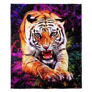 May include: A close-up of a tiger's face with an open mouth, showing sharp teeth. The tiger is in a colorful, abstract background with splashes of pink, purple, green, and yellow.