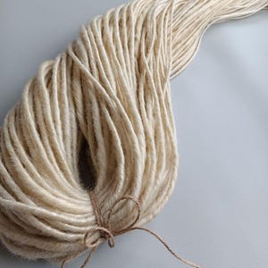 This set is Synthetic blonde crochet dreadlocks. This set can be Double ended dreads (DE) and Single ended dreads (SE) variation. This kit of dreads made by Synthetic hair - Kanekalon and ready to extensions. The material is light and absolutely safe