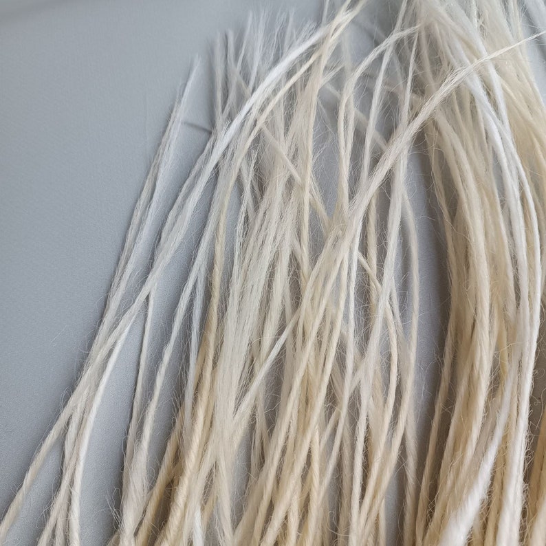This set is Synthetic blonde crochet dreadlocks. This set can be Double ended dreads (DE) and Single ended dreads (SE) variation. This kit of dreads made by Synthetic hair - Kanekalon and ready to extensions. The material is light and absolutely safe