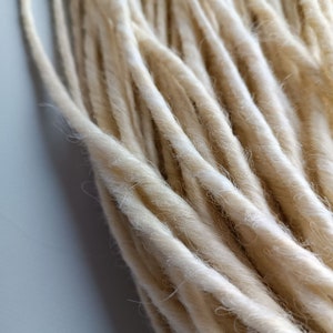 This set is Synthetic blonde crochet dreadlocks. This set can be Double ended dreads (DE) and Single ended dreads (SE) variation. This kit of dreads made by Synthetic hair - Kanekalon and ready to extensions. The material is light and absolutely safe