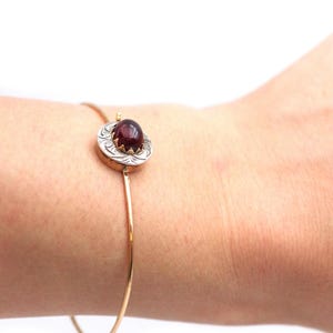 Garnet bangle bracelet in 18k gold and silver, cabochon cut garnet, antique clasp, assembled into a bracelet, antique jewelry | Maison Mohs