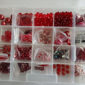 Mixed Red Glass Beads in a Case