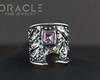 May include: A silver ring with a textured design and a purple gemstone in the center. The ring is wide and has a unique, organic shape.