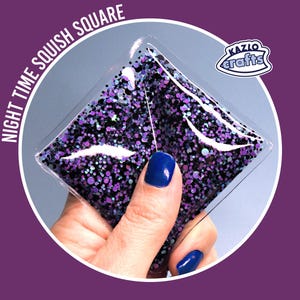 May include: A clear, square squish toy filled with purple and black glitter. The words "NIGHT TIME SQUISH SQUARE" are printed on the top left. The brand logo "Kazlo Crafts" is on the top right.