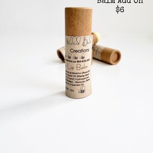 May include: A brown tube of natural lip balm with the text "Wicked Bees Creations" and "Lip Balm" on the label. The lip balm is $6 and is an add-on item.