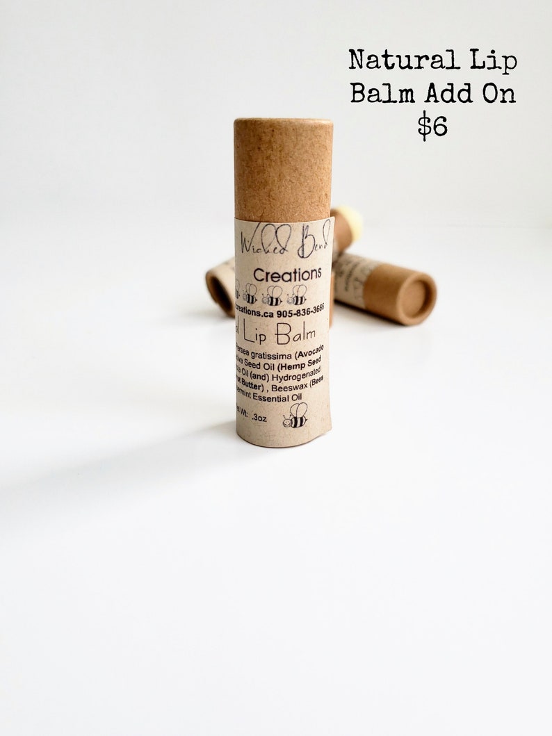 May include: A brown tube of natural lip balm with the text "Wicked Bees Creations" and "Lip Balm" on the label. The lip balm is $6 and is an add-on item.