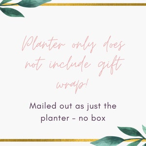 May include: A white card with a gold border and green leafy vines in the corners. The text on the card reads "Planter only does not include gift wrap! Mailed out as just the planter - no box."