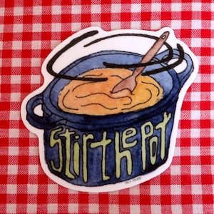 May include: A sticker depicting a blue pot with the words "Stir the Pot" in green. Inside the pot is a yellow liquid and a wooden spoon. The sticker is set against a red and white checked background.