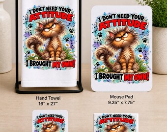 May include: A white hand towel, mouse pad, magnet, and ceramic coaster featuring a graphic of a grumpy brown cat with messy fur. The text reads I DON'T NEED YOUR ATTITUDE I BROUGHT MY OWN! The items measure 16" x 27", 9.25" x 7.75", 3" x 4", and 4" x 4".
