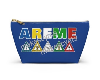May include: A blue zippered pouch with the word "AREME" in colorful letters. Five triangular symbols are below the word, each with a different color and symbol.