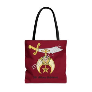 May include: A red tote bag with a white crescent moon and star design, a gold sword, and the text "Sir Allena Robinson".