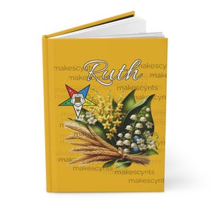 May include: A yellow journal with the name "Ruth" printed in black cursive. The cover features a bouquet of yellow flowers, white lilies of the valley, and wheat stalks. A colorful five-pointed star with a Masonic symbol is in the background.