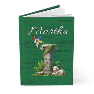 May include: Green journal with the name "Martha" in script. The cover features a decorative pillar, a lamb, and a symbol with a star and geometric shapes. The background has the text "makescynts" repeated.