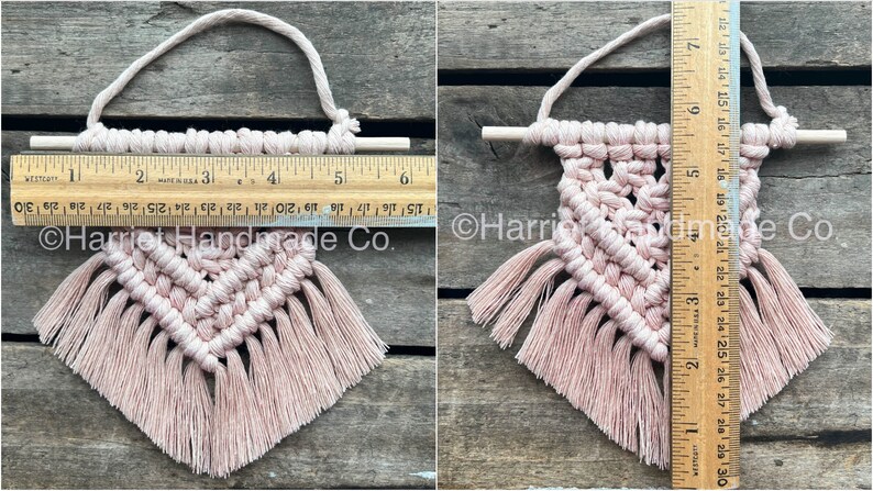 May include: A small pink macrame wall hanging with a wooden dowel and fringe. The hanging is approximately 6 inches tall and 5 inches wide.