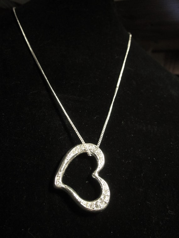 Silver toned heart jeweled pendant necklace