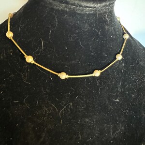 gold toned and white beaded necklace