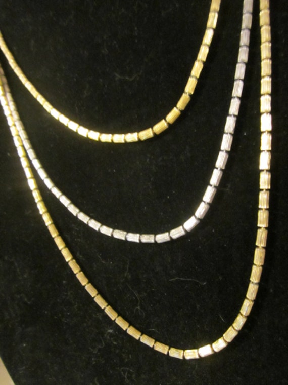 Multi strand gold and silver toned necklace - image 1