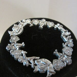 Silver* toned charm bracelet