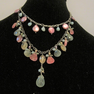Fashion* multi strand beaded necklace on silver toned chain