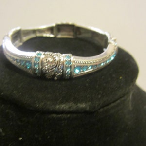Silver* toned with blue crystals bracelet