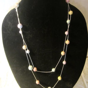 multi colored beaded necklace on a silver toned chain