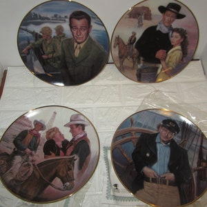 Four large 10" John Wayne collector plates