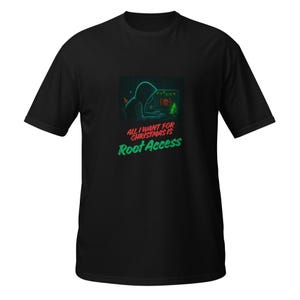 May include: Black t-shirt with a graphic featuring a hooded figure working on a computer. The text reads "ALL I WANT FOR CHRISTMAS IS ROOT ACCESS" in green and red. The design includes a Christmas tree and a skull icon.