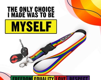 May include: A rainbow lanyard with a black clip and a key ring. The lanyard has the text "The only choice I made was to be MYSELF" printed on it. The lanyard is on a white background with a rainbow and pink background behind it. The text "FREEDOM EQUALITY LOVE RESPECT" is printed in black on a rainbow background.