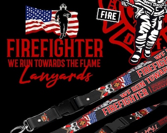 May include: Two black lanyards with red, white, and blue firefighter themed designs. One lanyard features a skull and crossbones with an American flag. The other lanyard features a firefighter running towards a flame with the text "FIREFIGHTER WE RUN TOWARDS THE FLAME".