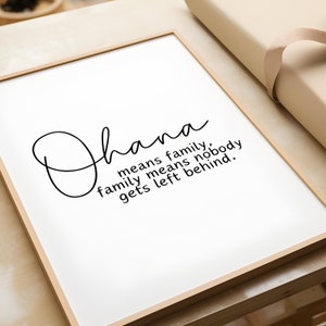 May include: A framed print with the word "Ohana" written in cursive. The text below reads "means family, family means nobody gets left behind."