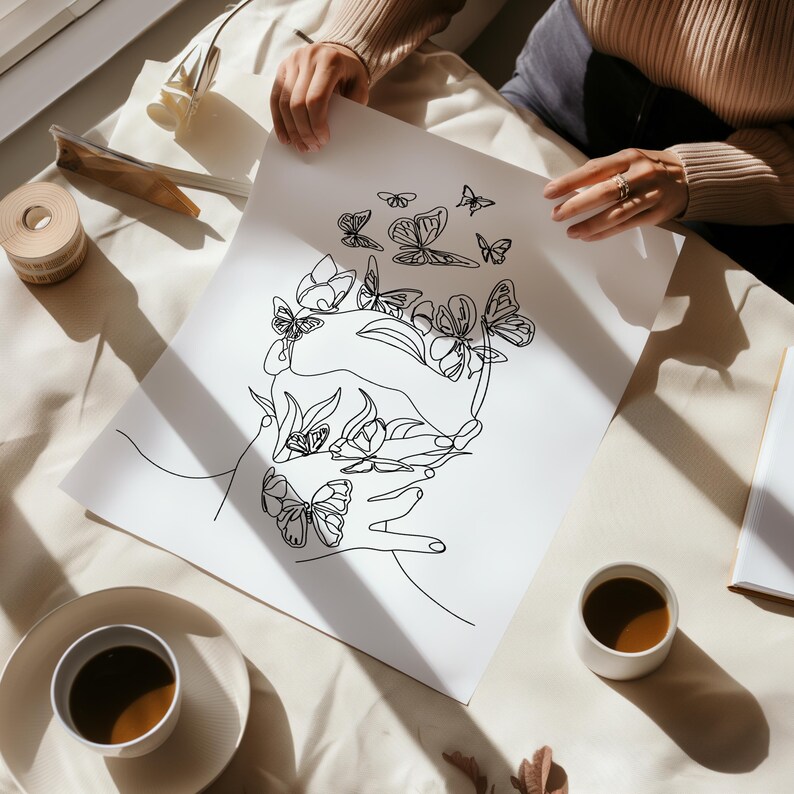 May include: A black and white line drawing of a hand holding a sphere with butterflies and flowers inside. The drawing is on a white sheet of paper.