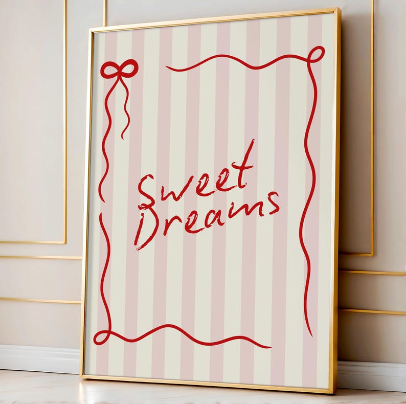May include: A framed print with a pink and white striped background. The print features a red ribbon border with the words "Sweet Dreams" written in red cursive.