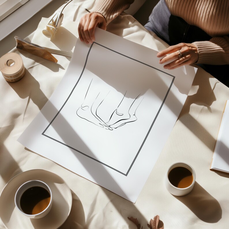 May include: A black and white line drawing of three feet on a white background. The drawing is framed with a black border and is on a white surface.