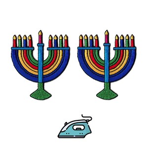 May include: Two embroidered patches shaped like menorahs, each featuring a central blue stem, a green base, and curved arms in blue, yellow, and red. Each menorah has nine lit candles with yellow flames. Below is a small light blue iron icon.