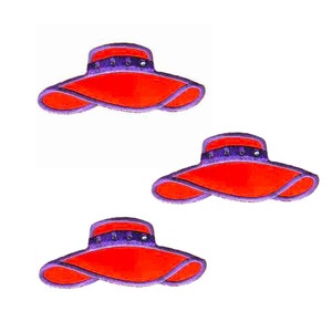 May include: Three red and purple felt fabric hats with a wide brim. The hats are embroidered with a purple band and white dots.