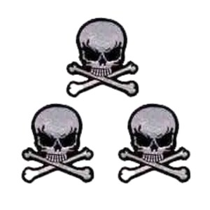 May include: Three identical embroidered patches, each featuring a light gray skull with dark eye sockets and a set of crossed bones positioned directly underneath. The design is outlined in a thick black border, creating a high-contrast graphic.