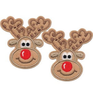 May include: Two brown felt reindeer head appliques with red noses and white eyes. The reindeer have brown antlers with a white outline.