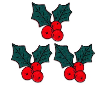 May include: Three embroidered patches, each featuring a pair of dark green holly leaves with detailed black stitching for veins and three bright red berries. The patches are identical in design, showcasing a festive botanical motif with clean edges.