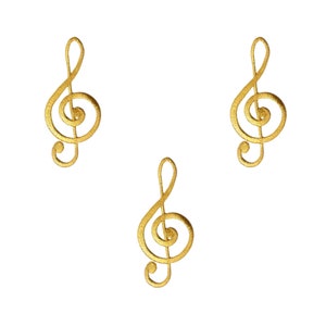 May include: Three gold treble clef music note charms. The charms are isolated on a white background.