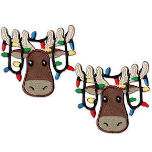 May include: Two brown moose with white antlers and a string of colorful Christmas lights wrapped around their antlers. The moose have black eyes and brown noses.