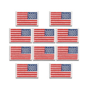 May include: A collection of nine rectangular embroidered patches, each featuring the flag of the United States with alternating red and white horizontal stripes and a blue canton containing white stars, arranged in a grid pattern on a white background.