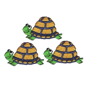 May include: Three green and yellow embroidered turtle patches. Each turtle has a blue shell with a yellow pattern and a green head and legs.