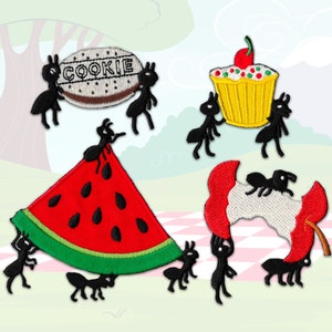 May include: Five black ants carrying different picnic items. One ant carries a cookie, another carries a cupcake, another carries a watermelon slice, another carries a half-eaten apple, and the last ant carries a cookie.