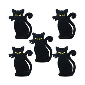 May include: Five black felt iron-on patches of black cats with yellow eyes. The cats are in a sitting position with their tails curled around their bodies.