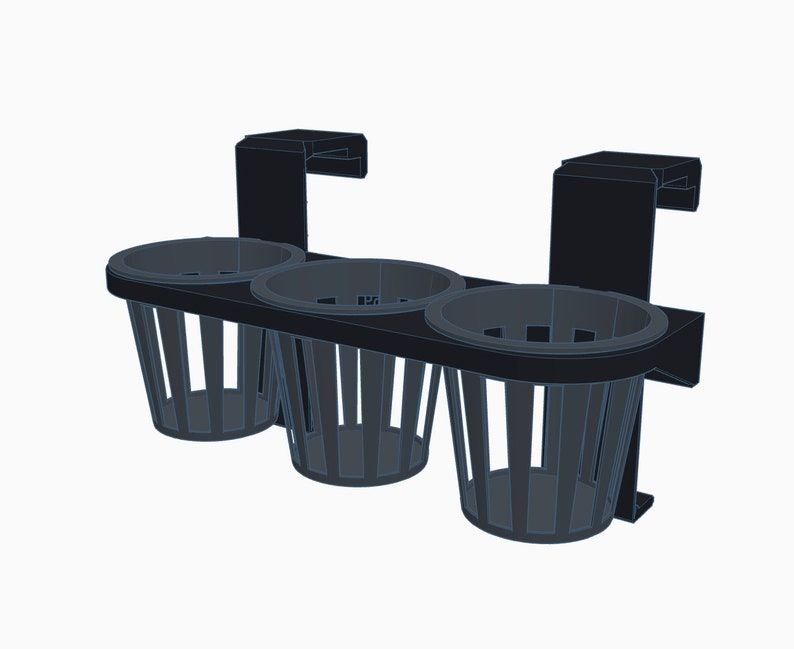 May include: Black metal cup holder with three wire cup holders. The holder has two clips on the back for attaching to a surface.