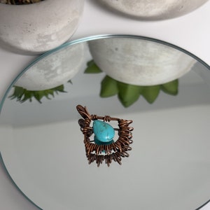 Southwest inspired copper wire wrapped pendant with acrylic turquoise bead.
