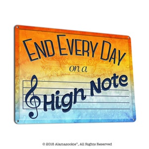 May include: A colorful metal sign with a watercolor background. The sign says "End Every Day on a High Note" with a treble clef and musical staff.