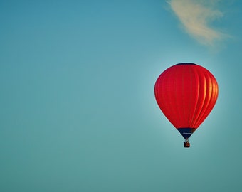 Red hot air balloon against a blue sky with whispy clouds - Red hot air balloon against a blue sky - Solo red hot air balloon - red balloon